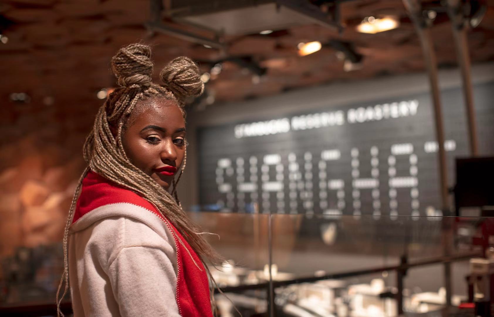 woman standing in Shanghai Starbucks Roastery